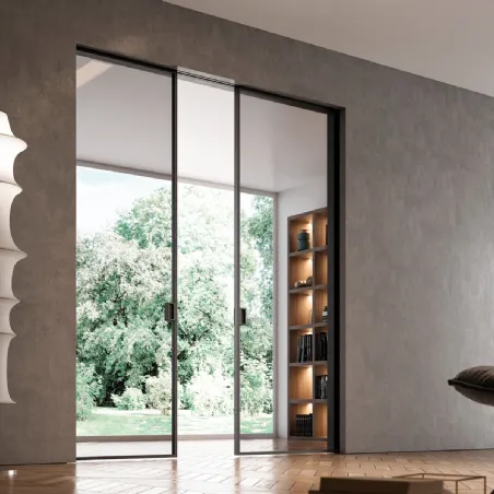 Portes coulissantes affleurantes à l'intérieur du mur en verre et aluminium conçues par Bertolotto